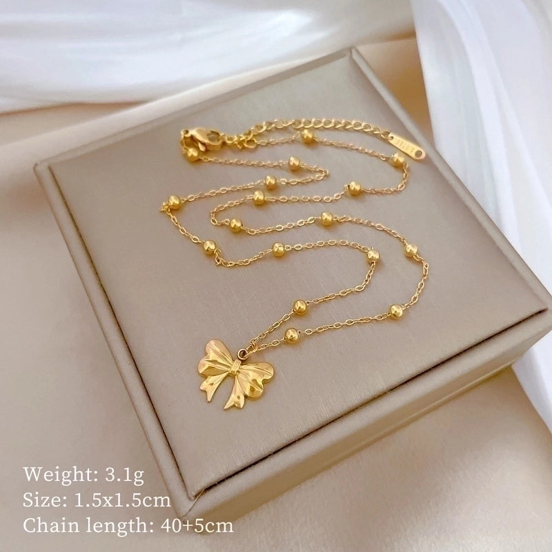 Gold Bow Pendant Necklace