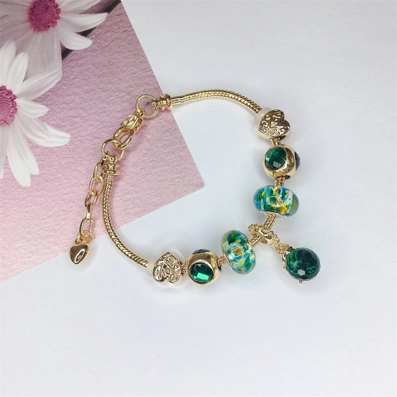 Pink and Gold Charm Bracelet